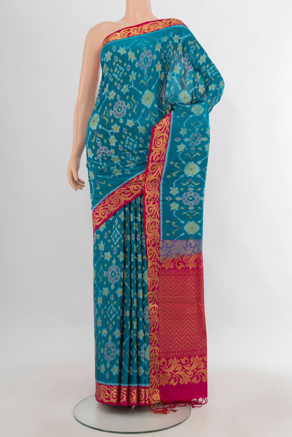 Pure Silk Light Blue Soft Saree with Ikat Print on the body and Zari Border.  displayed on a mannequin