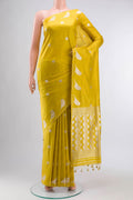 Yellow Banarasi Silk Saree with Zari Butta on the body and Zari Border displayed on a mannequin