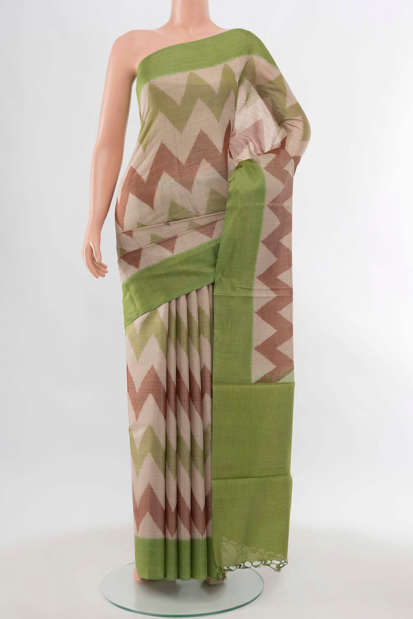 Pista Green Tussar Silk Saree with Zari Brocade on the body and Silk Border displayed on a mannequin