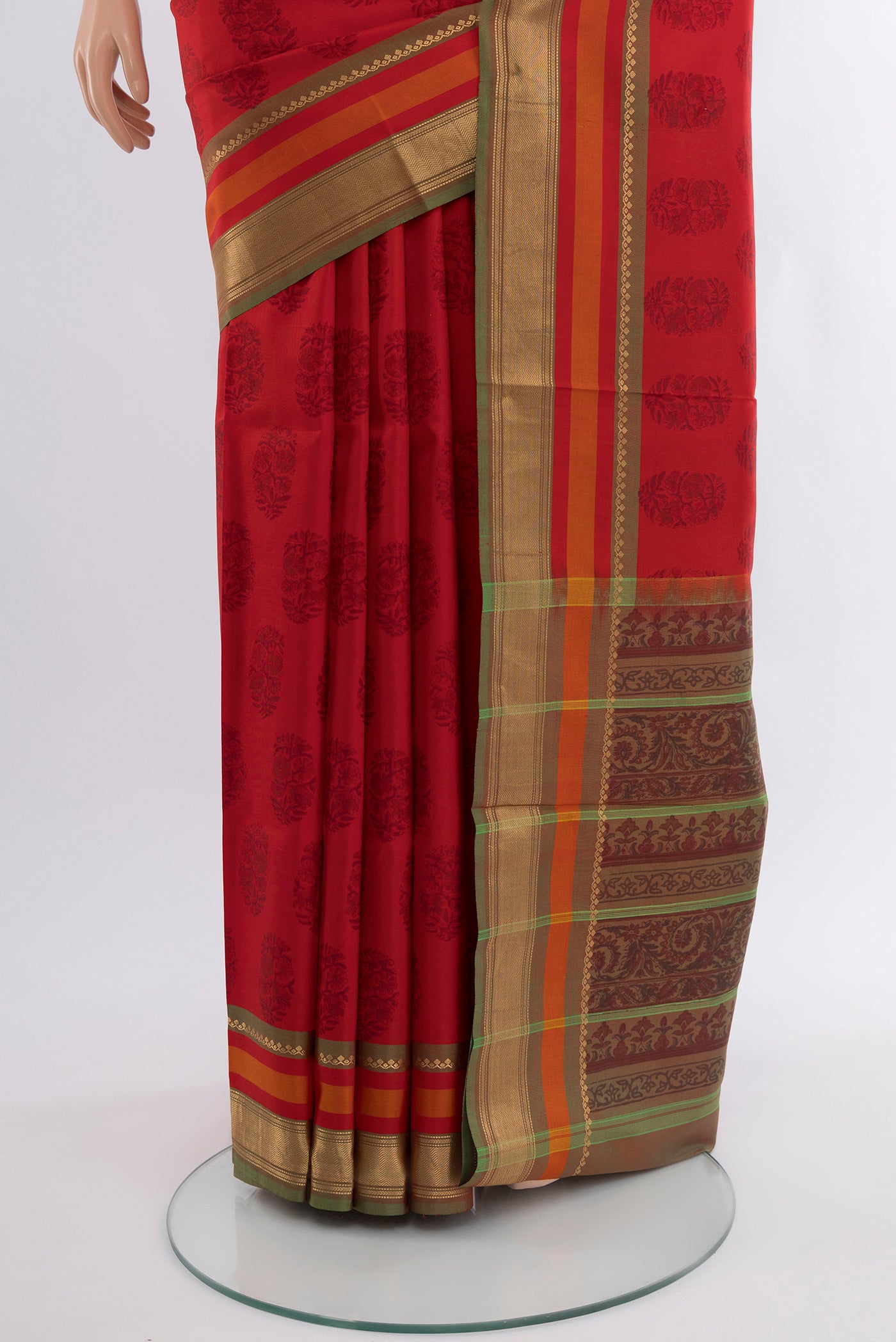Pleats and pallu of Red Printed Silk Saree with Floral Print on the body and Zari Border. 