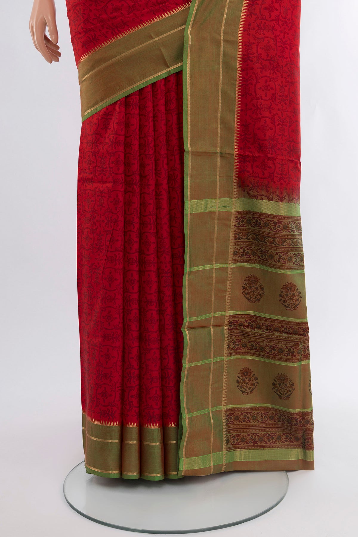 Pleats and pallu of Red Printed Silk Saree with Floral Print on the body and Zari Border. 
