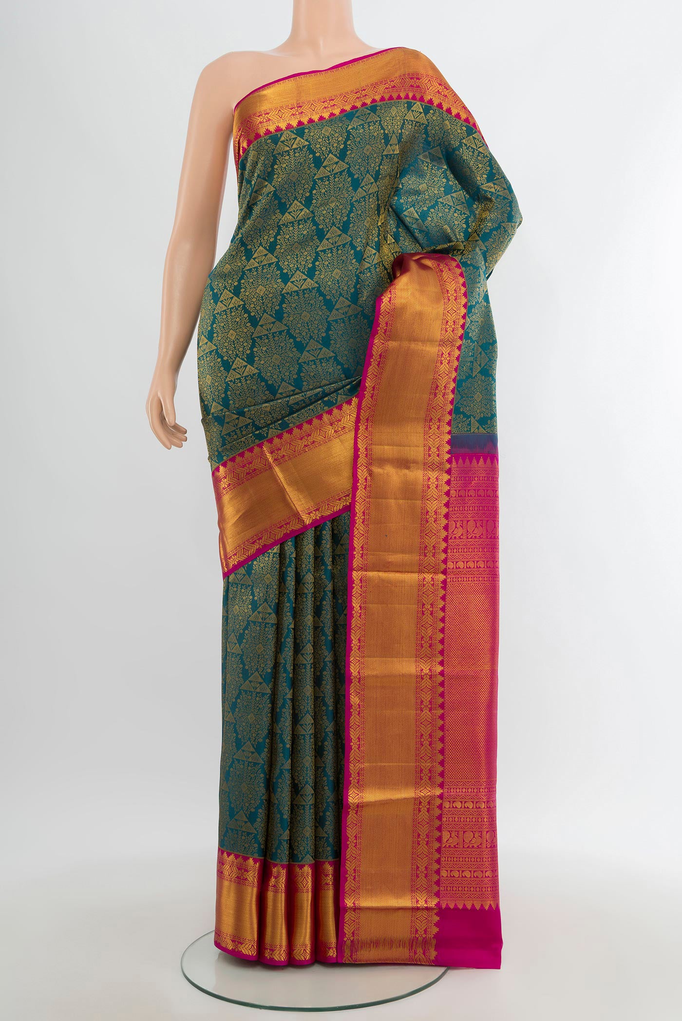 Peacock Blue Kanchipuram Silk Saree with Zari Brocade on the body and Zari Border.  displayed on a mannequin