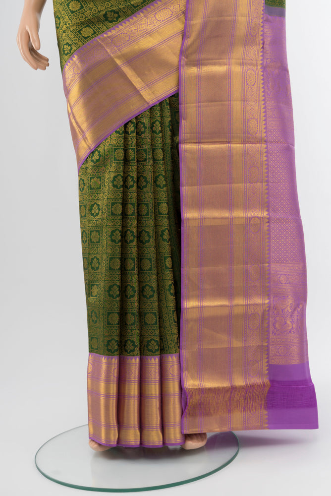 Pleats and pallu of Mint Green Kanchipuram Silk Saree with Zari Butta on the body and Silk Border. 