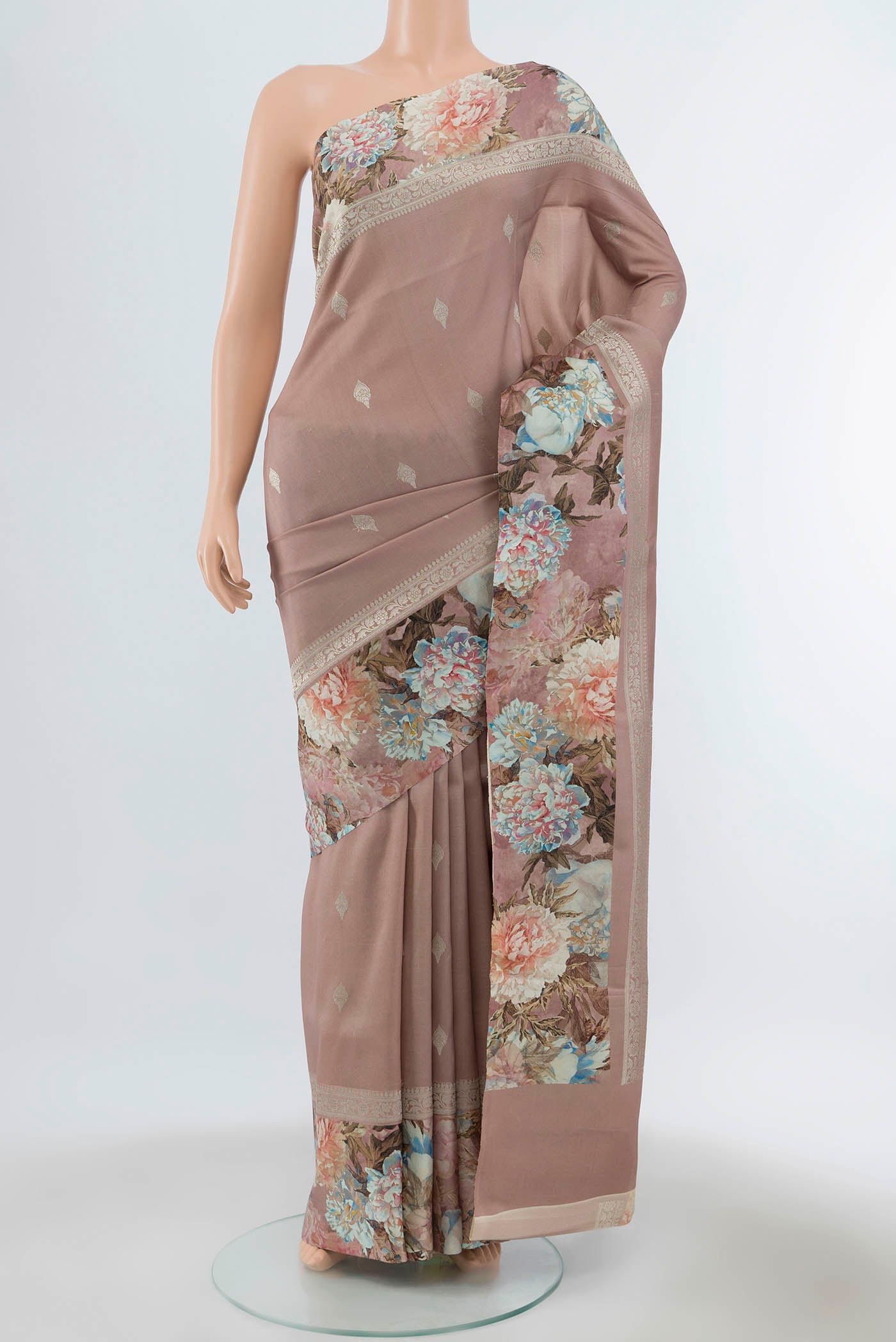 Pure Silk Pure Zari Peach Printed Saree with Floral Print on the body and Fancy Border displayed on a mannequin