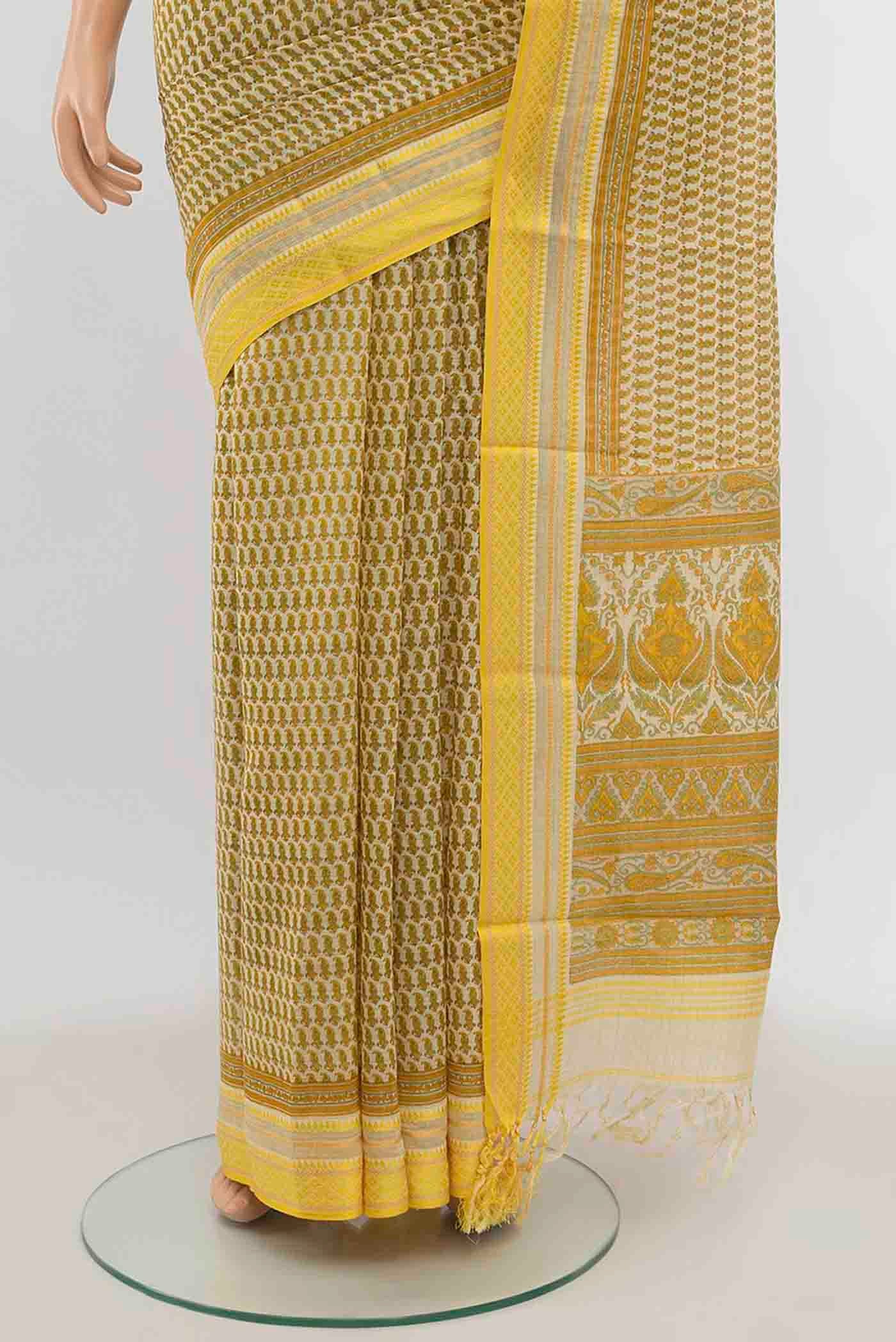 Pleats and pallu of Cream Maheshwari Silk Cotton Saree with Zari Butta on the body and Silk Border