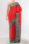 Orange Kanchipuram Silk Saree with Zari Butta on the body and Silk Border displayed on a mannequin