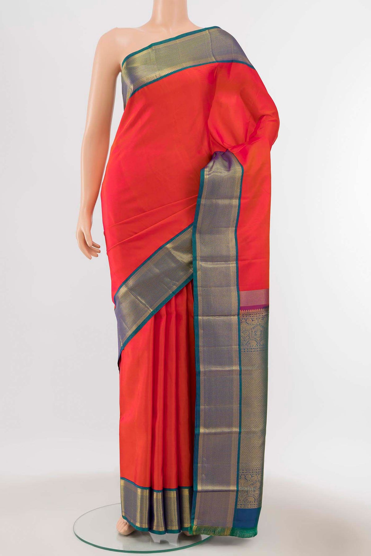 Orange Kanchipuram Silk Saree with Zari Butta on the body and Silk Border displayed on a mannequin
