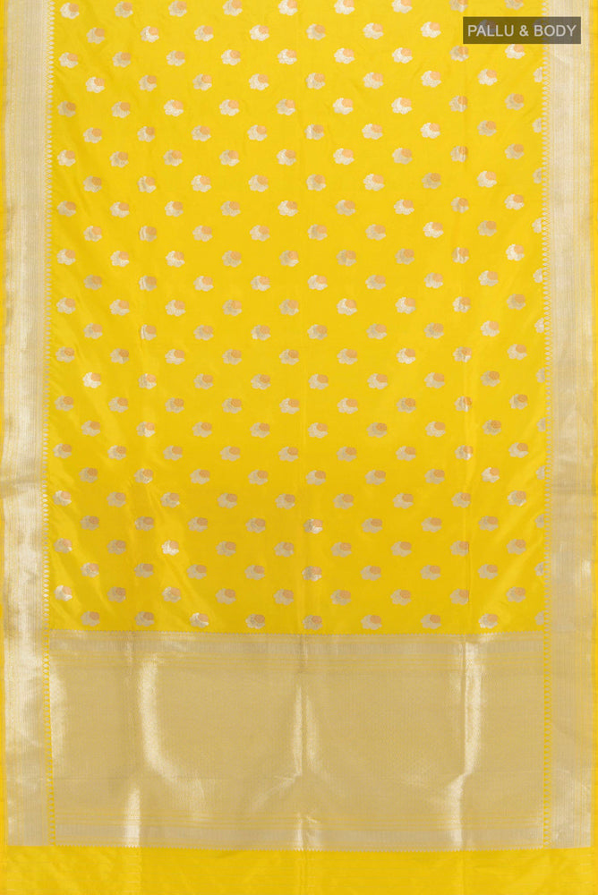 Flat view of Lemon Yellow Banarasi Katan Silk Saree with Zari Butta on the body and Silk Border. 