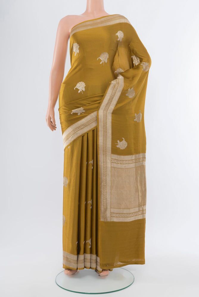 Mehandi Green Banarasi Katan Silk Saree with Zari Butta on the body and Silk Border.  displayed on a mannequin
