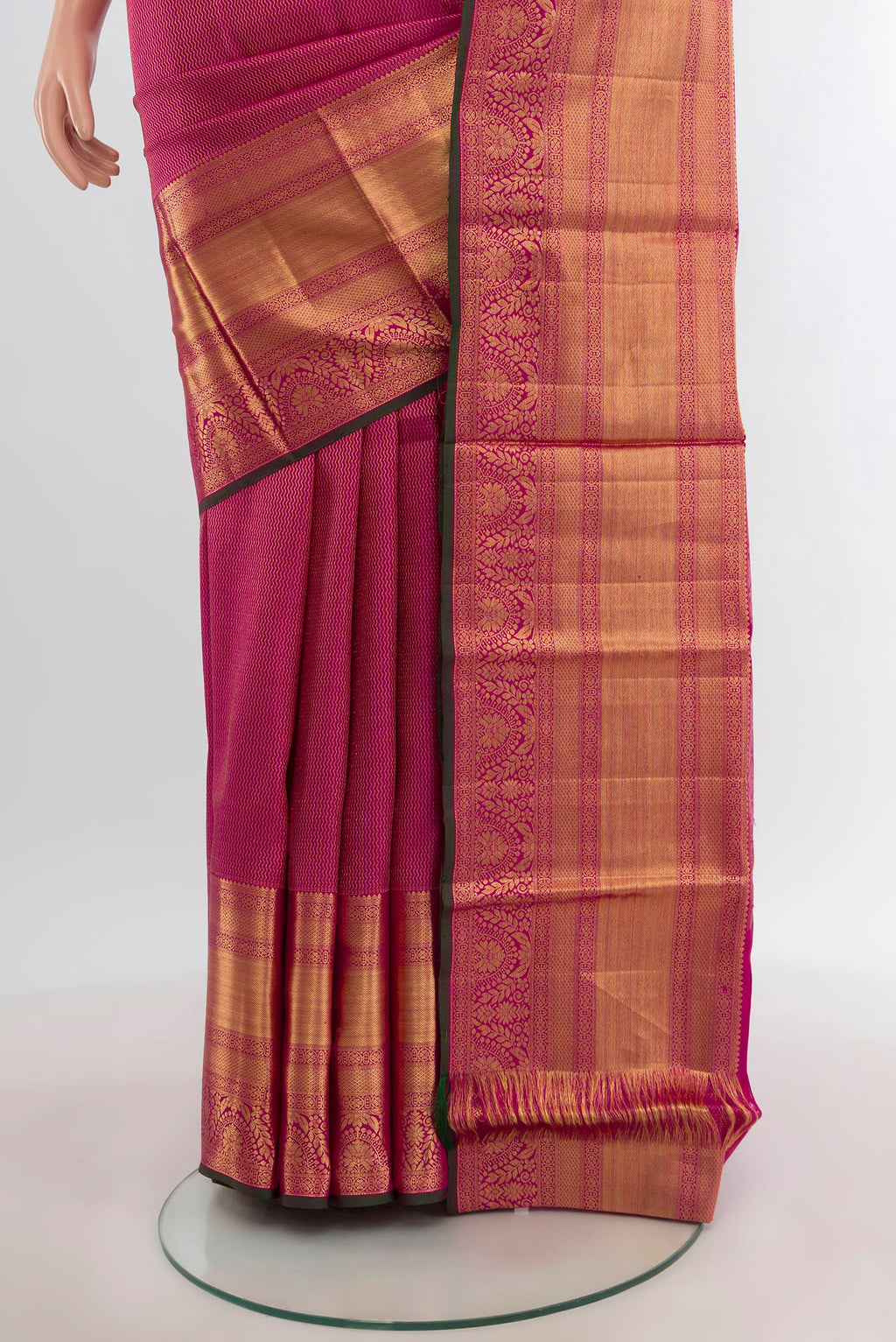 Pleats and pallu of Magenta Kanchipuram Silk Saree with Zari Brocade on the body and Silk Border. 