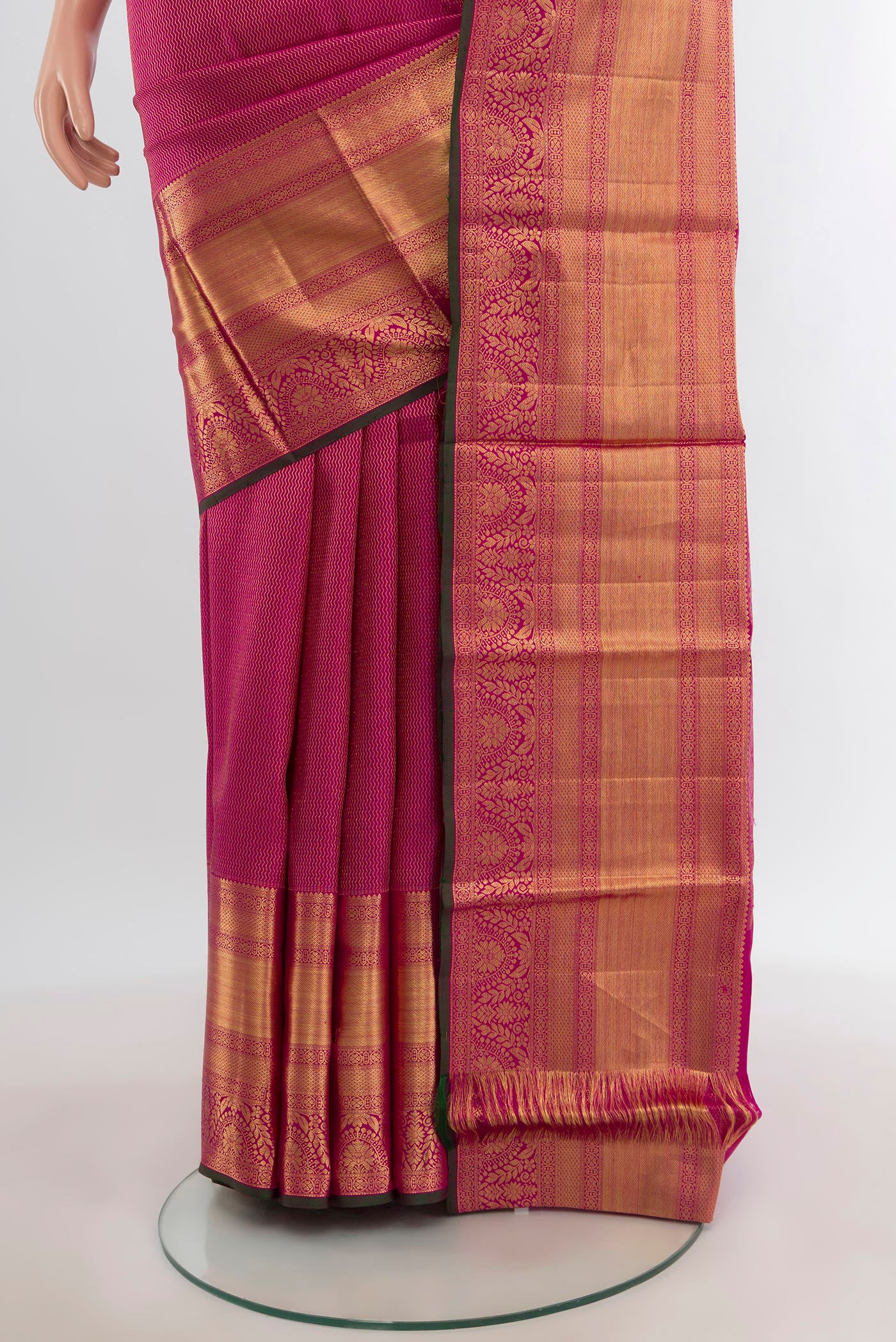 Pleats and pallu of Magenta Kanchipuram Silk Saree with Zari Brocade on the body and Silk Border. 