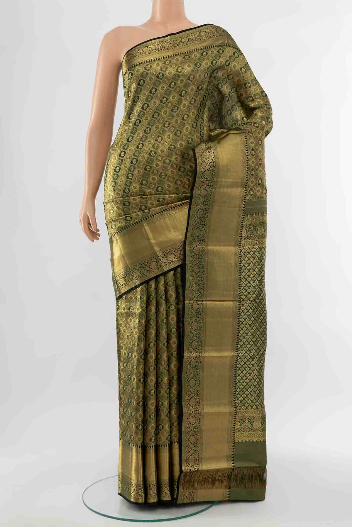 Bottle Green Kanchipuram Silk Saree with Zari Butta on the body and Silk Border displayed on a mannequin