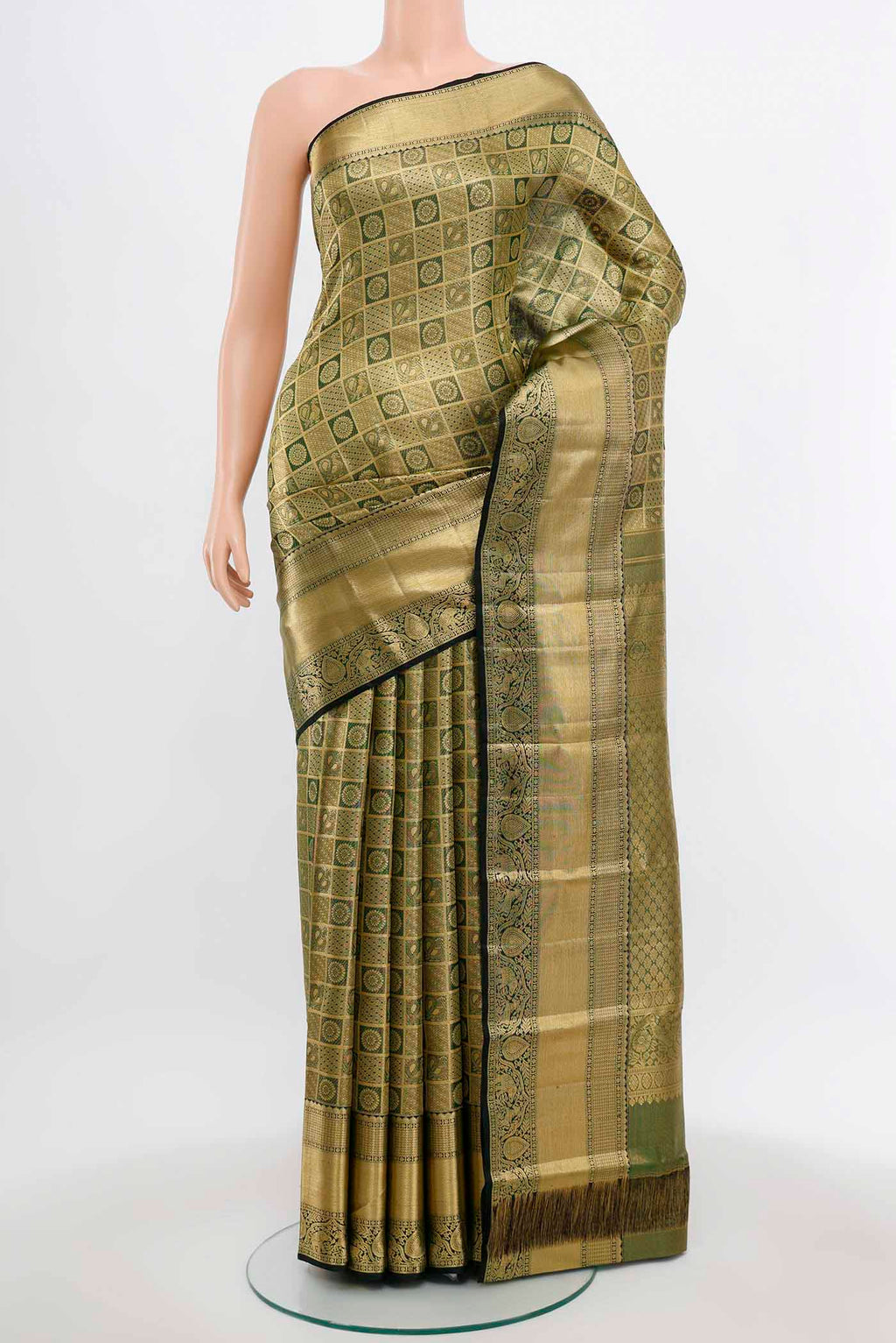 Golden Kanchipuram Silk Saree with Zari Butta on the body and Silk Border.  displayed on a mannequin