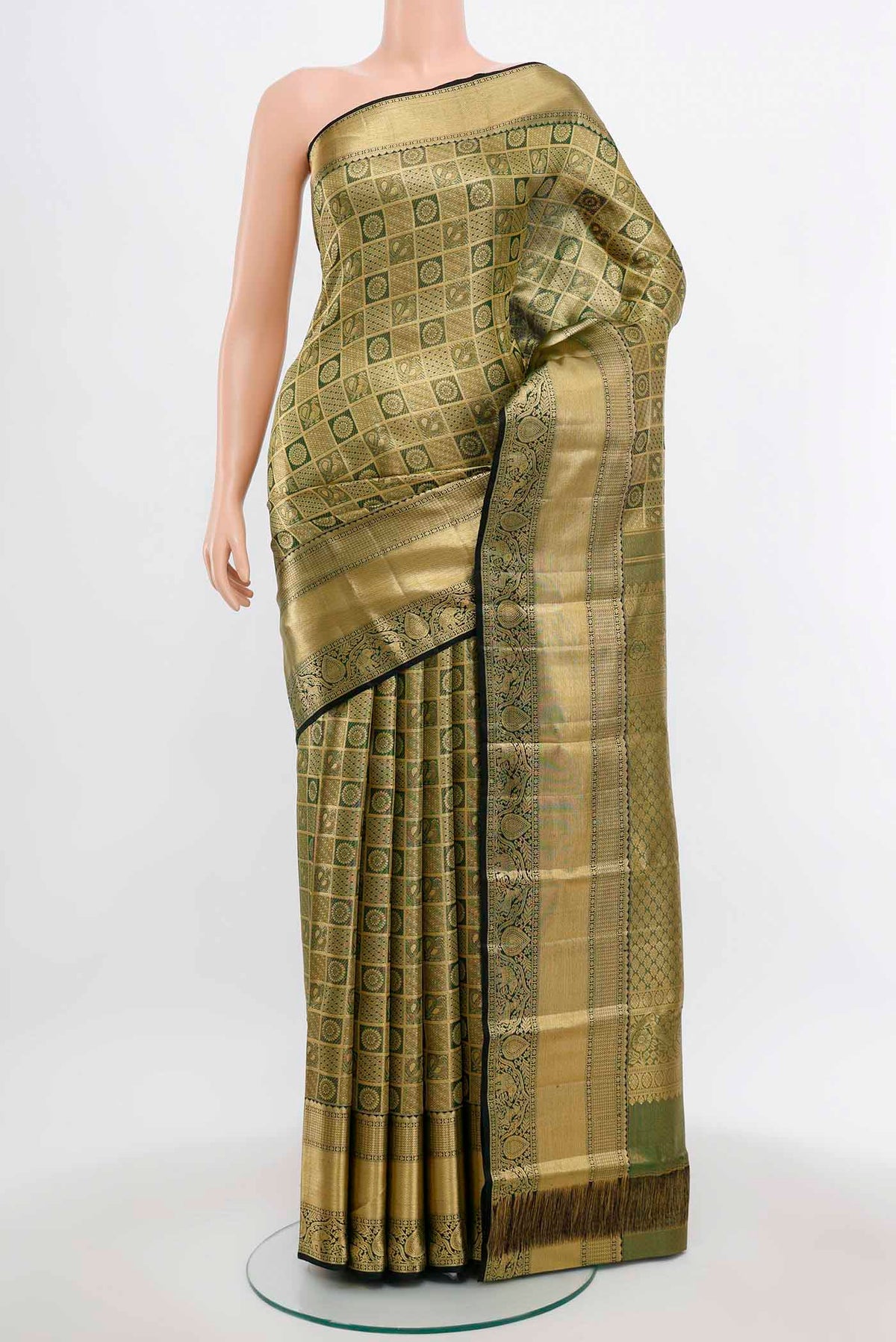 Golden Kanchipuram Silk Saree with Zari Butta on the body and Silk Border.  displayed on a mannequin