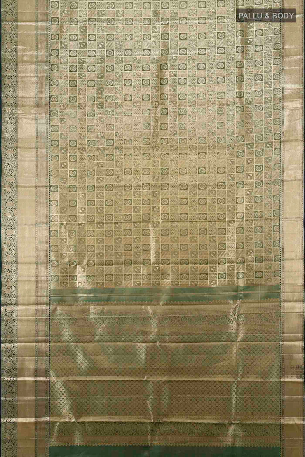 Flat view of Golden Kanchipuram Silk Saree with Zari Butta on the body and Silk Border. 