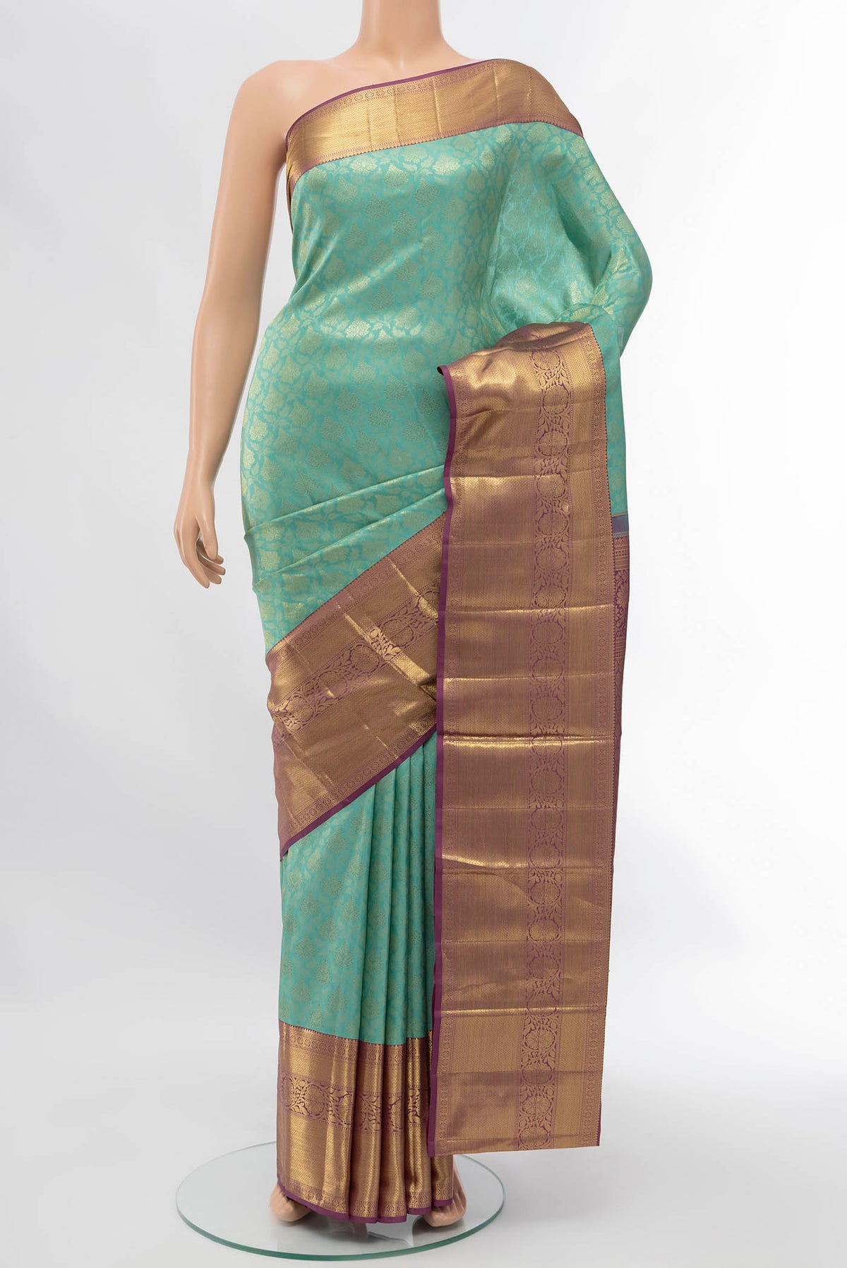 Sea Green Kanchipuram Silk Saree with Zari Butta on the body and Silk Border displayed on a mannequin