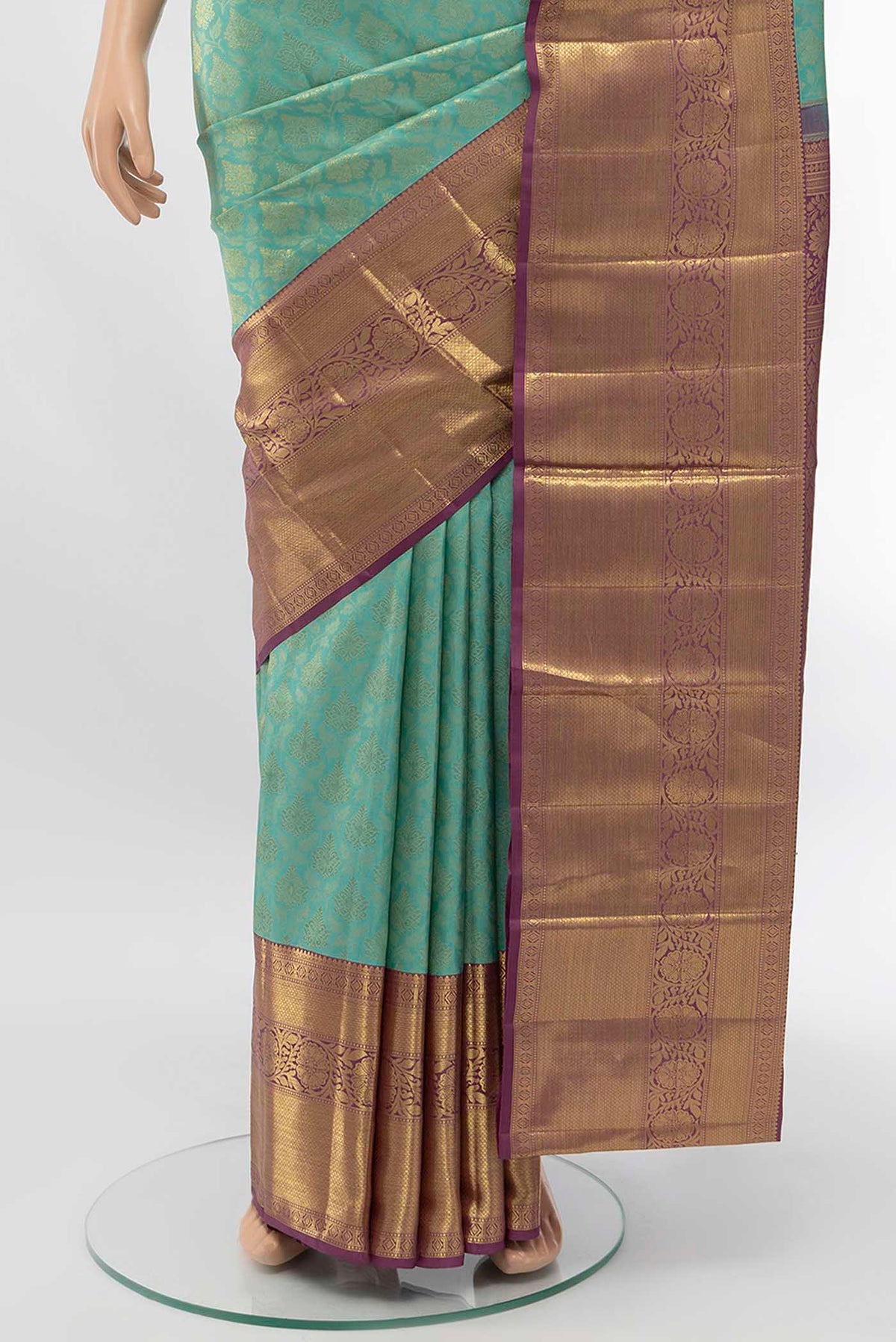 Pleats and pallu of Sea Green Kanchipuram Silk Saree with Zari Butta on the body and Silk Border