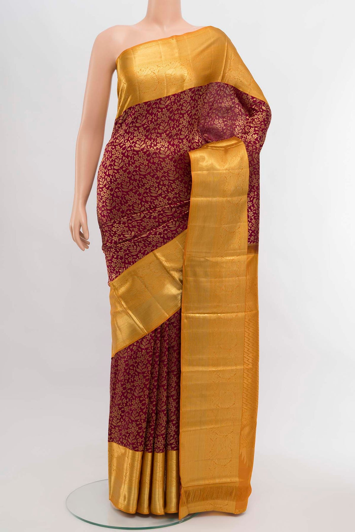 Magenta Kanchipuram Silk Saree with Zari Brocade on the body and Silk Border displayed on a mannequin