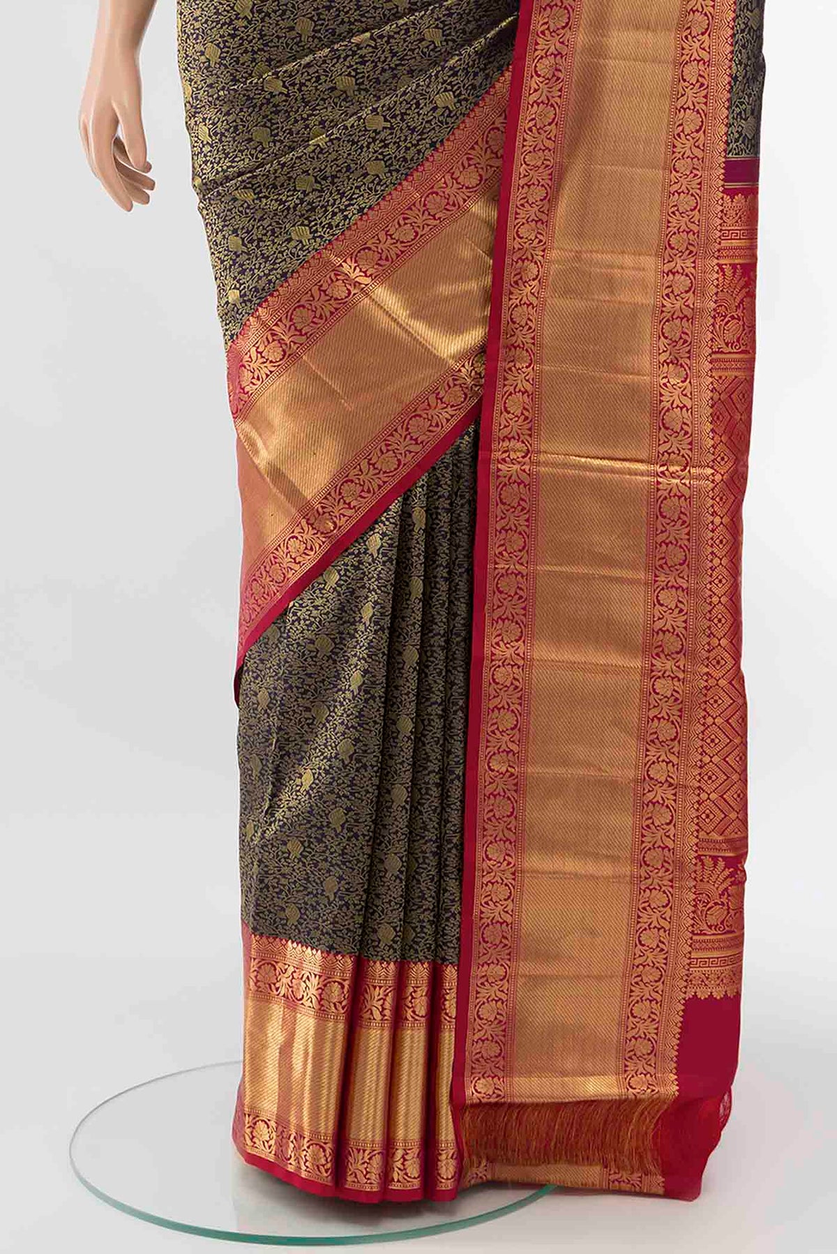 Pleats and pallu of Navy Blue Kanchipuram Silk Saree with Zari Butta on the body and Silk Border