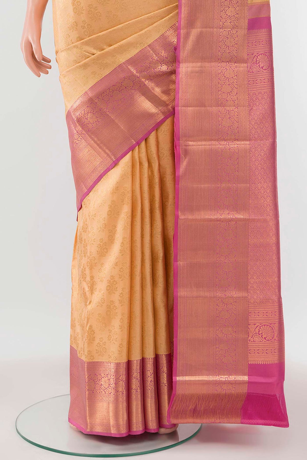 Pleats and pallu of Rose Gold Kanchipuram Silk Saree with Zari Butta on the body and Silk Border