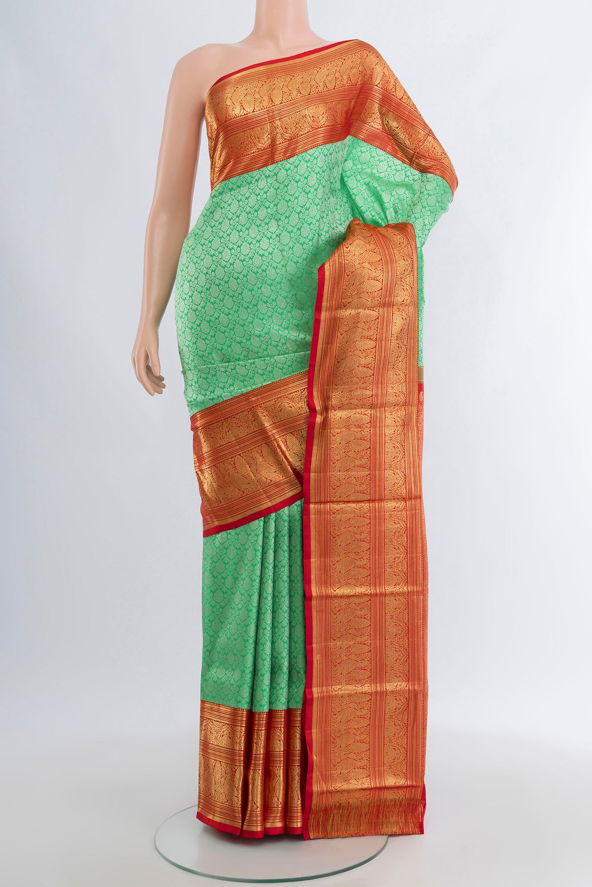 Sea Green Kanchipuram Silk Saree with Zari Brocade on the body and Zari Border.  displayed on a mannequin