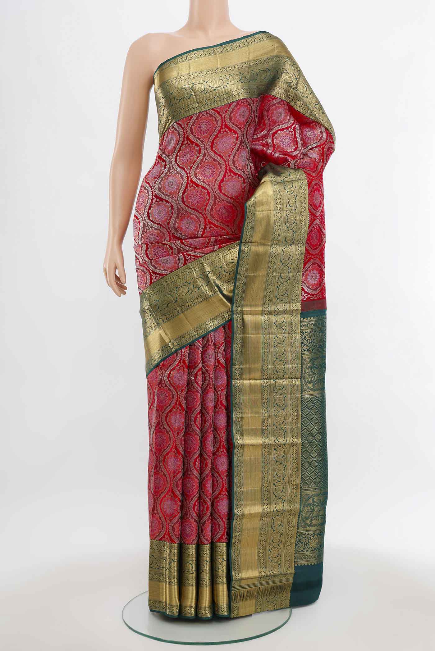 Deep Red Kanchipuram Silk Saree with Zari Butta on the body and Silk Border.  displayed on a mannequin