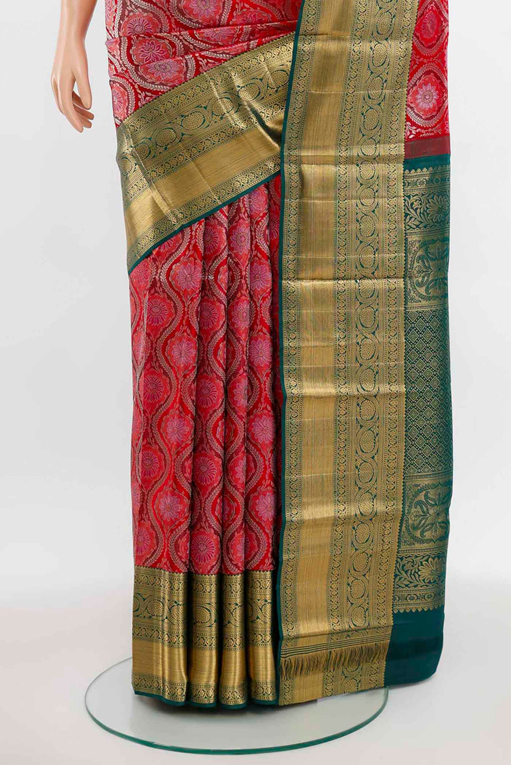 Pleats and pallu of Deep Red Kanchipuram Silk Saree with Zari Butta on the body and Silk Border. 