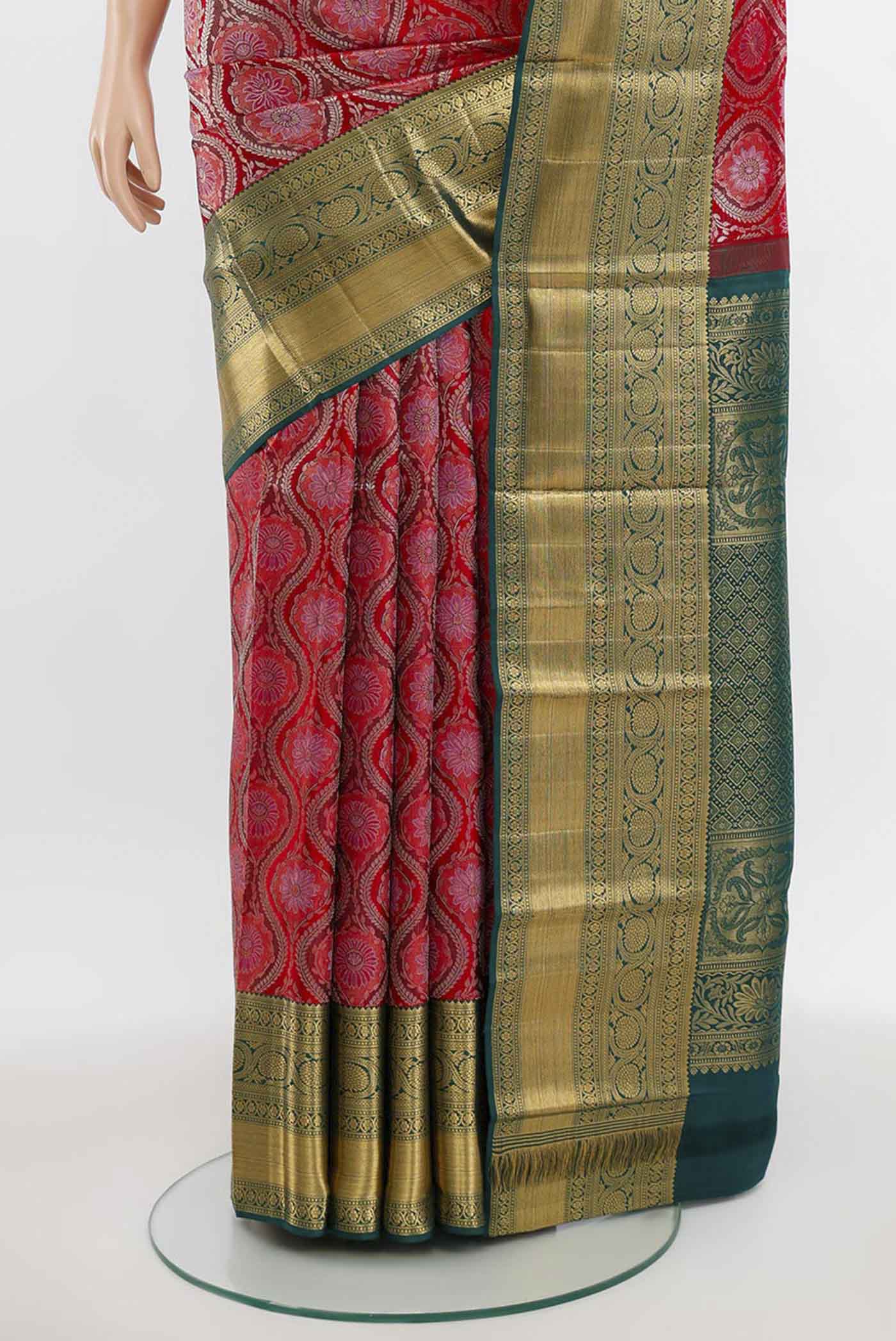 Pleats and pallu of Deep Red Kanchipuram Silk Saree with Zari Butta on the body and Silk Border. 