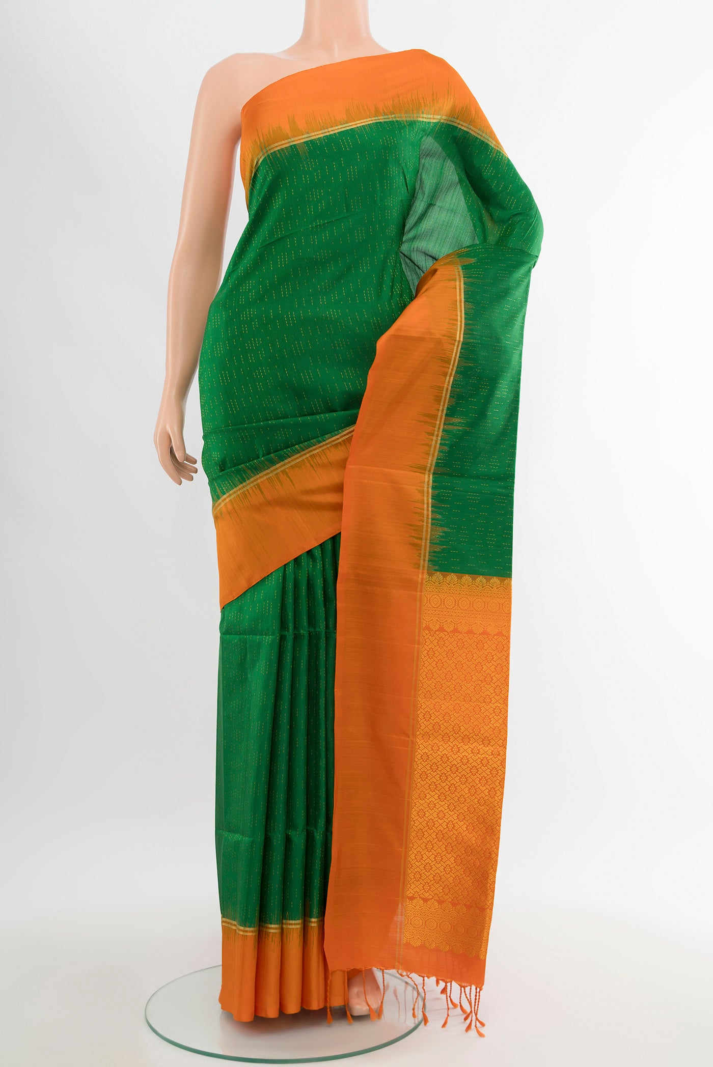 Mint Green Soft Silk Saree with Zari Butta on the body and Silk Border.  displayed on a mannequin