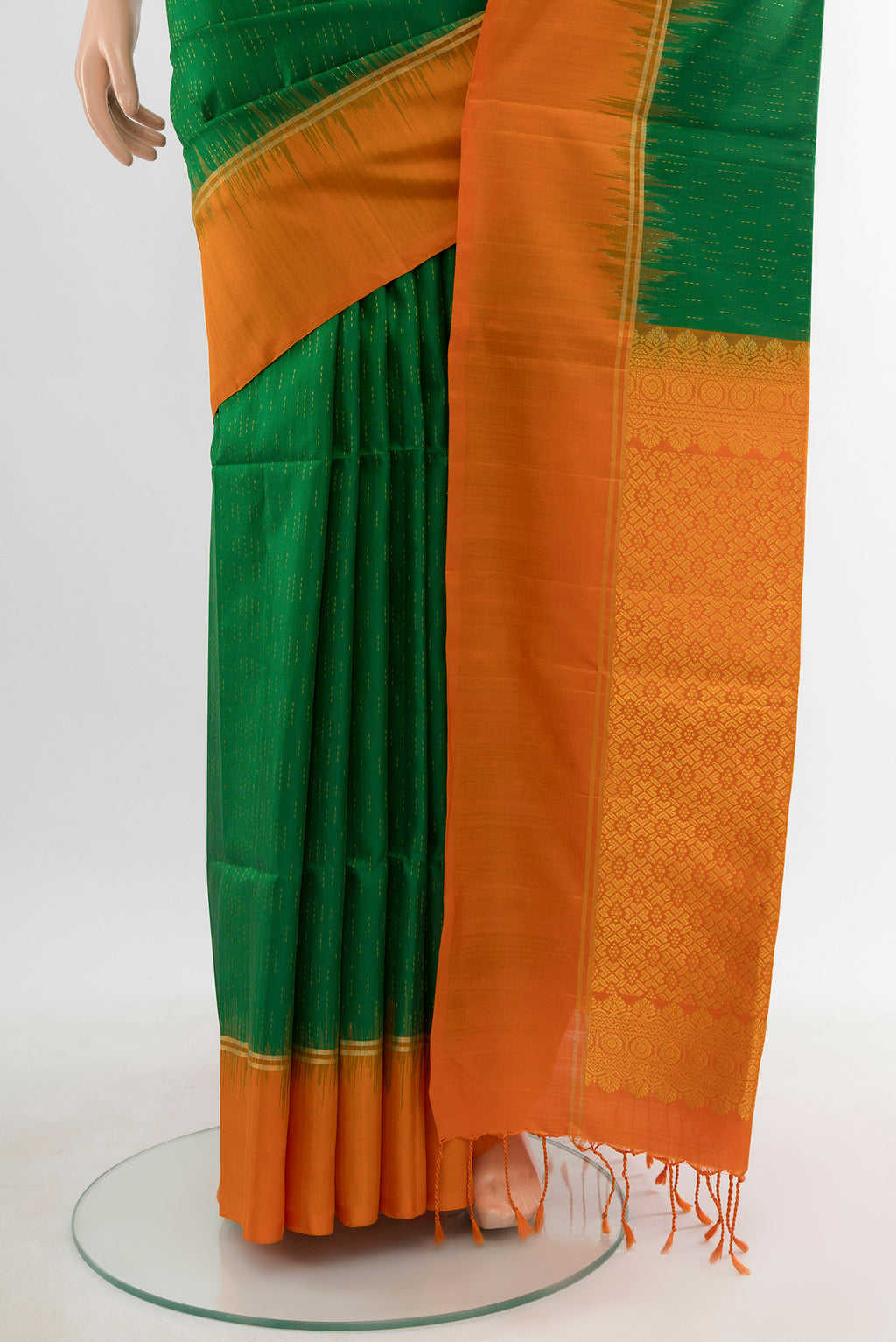 Pleats and pallu of Mint Green Soft Silk Saree with Zari Butta on the body and Silk Border. 