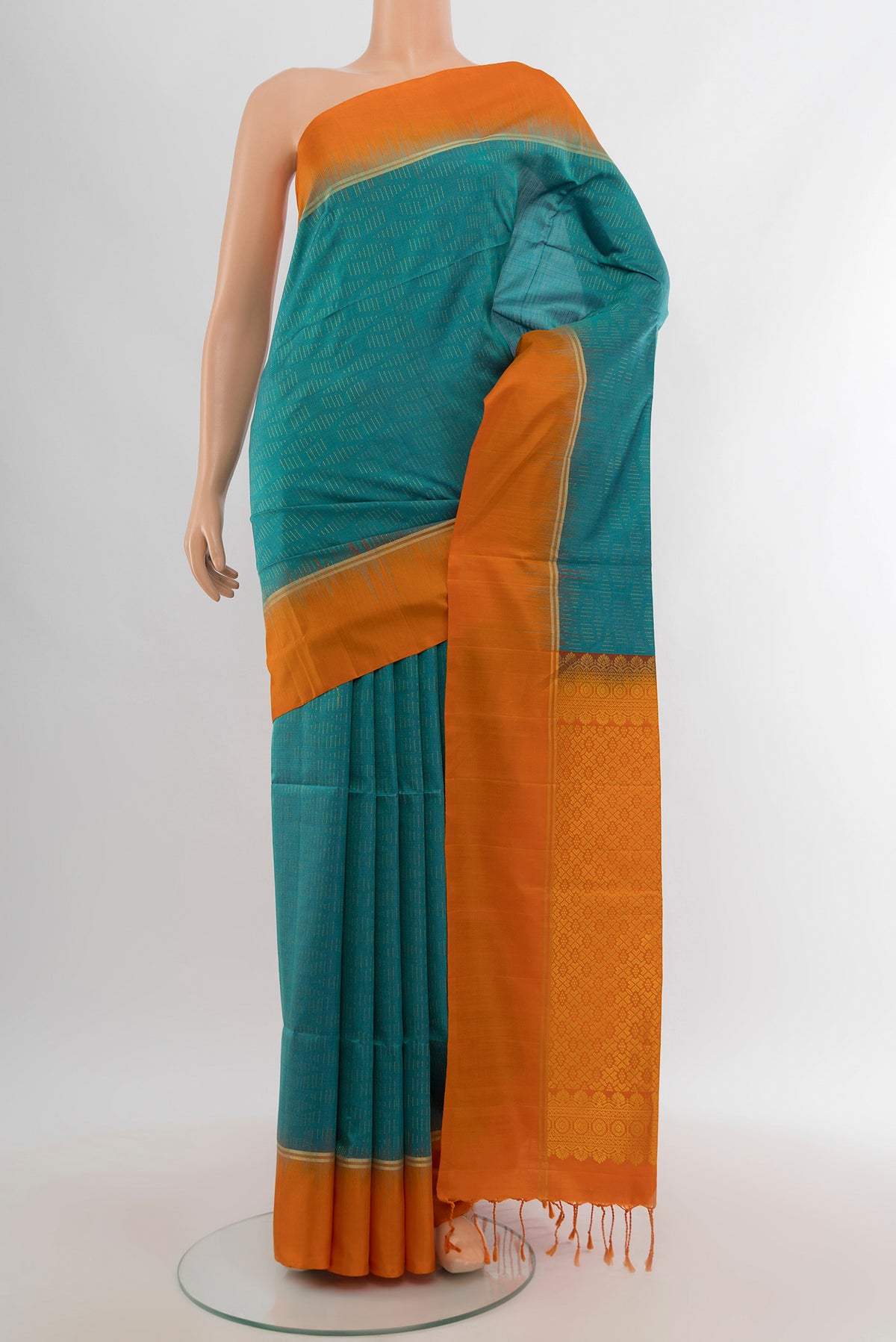 Light Blue Soft Silk Saree with Zari Butta on the body and Plain Border.  displayed on a mannequin