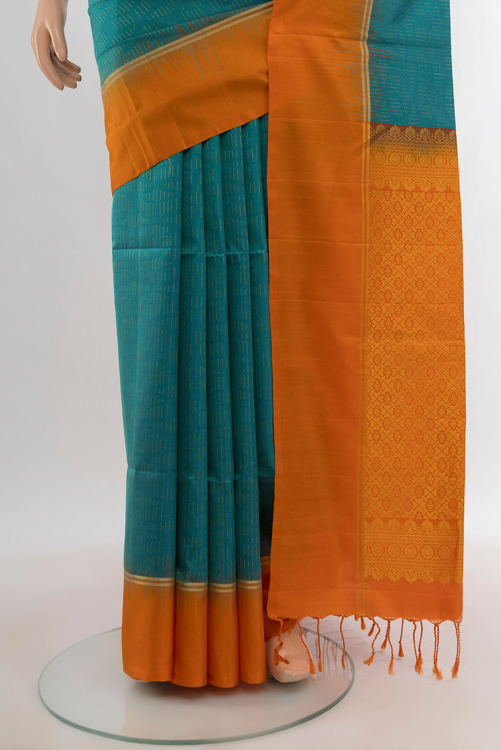 Pleats and pallu of Light Blue Soft Silk Saree with Zari Butta on the body and Plain Border. 