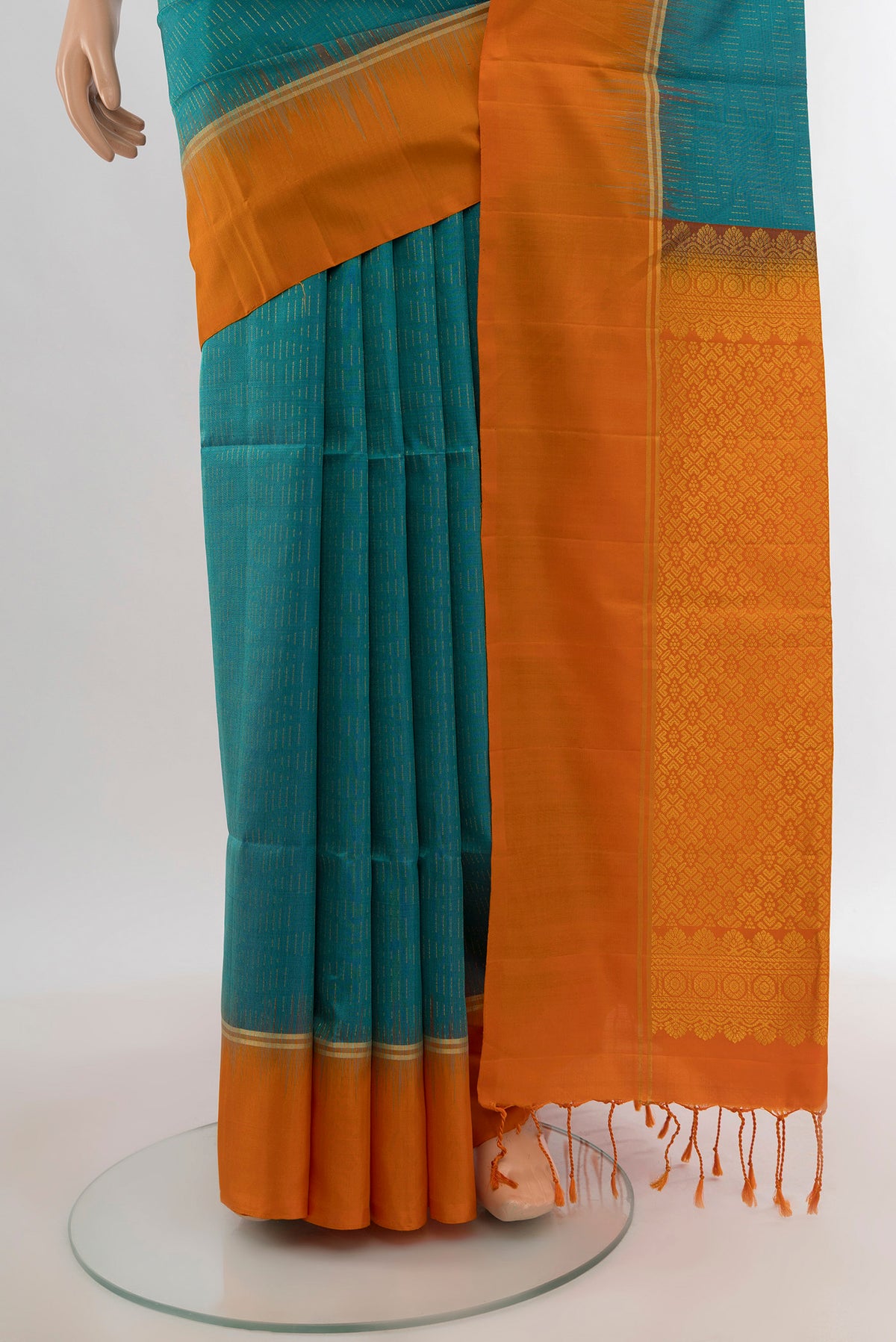 Pleats and pallu of Light Blue Soft Silk Saree with Zari Butta on the body and Plain Border. 
