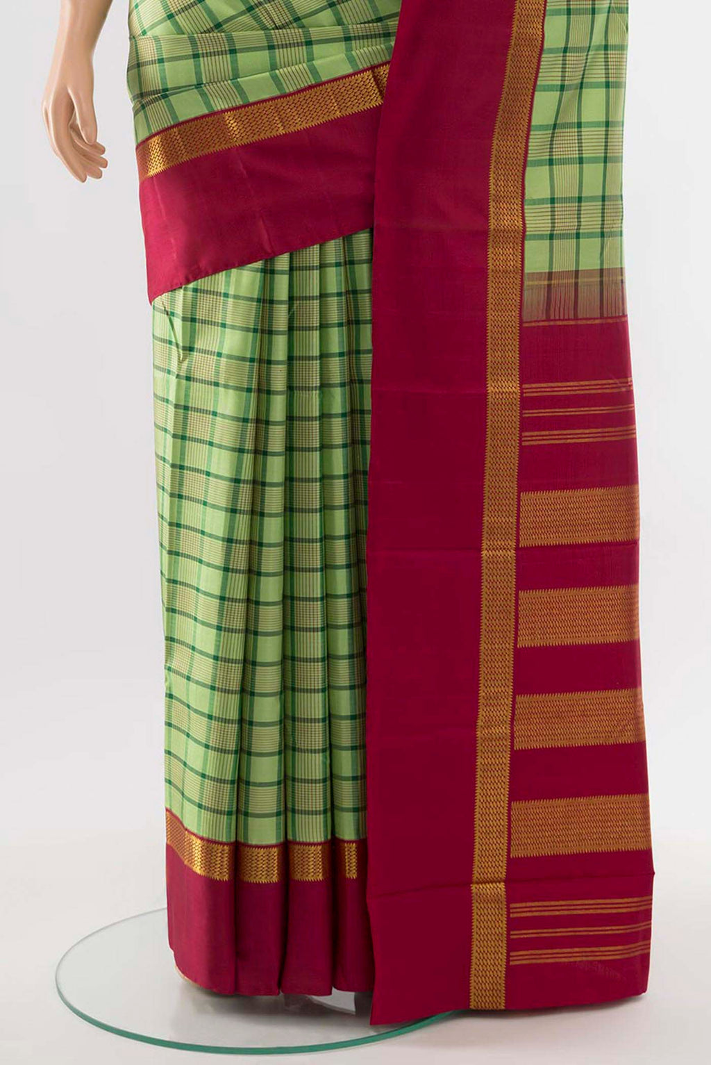 Pleats and pallu of Light Green Kanjivaram Silk Saree with Zari Butta on the body and Silk Border. 