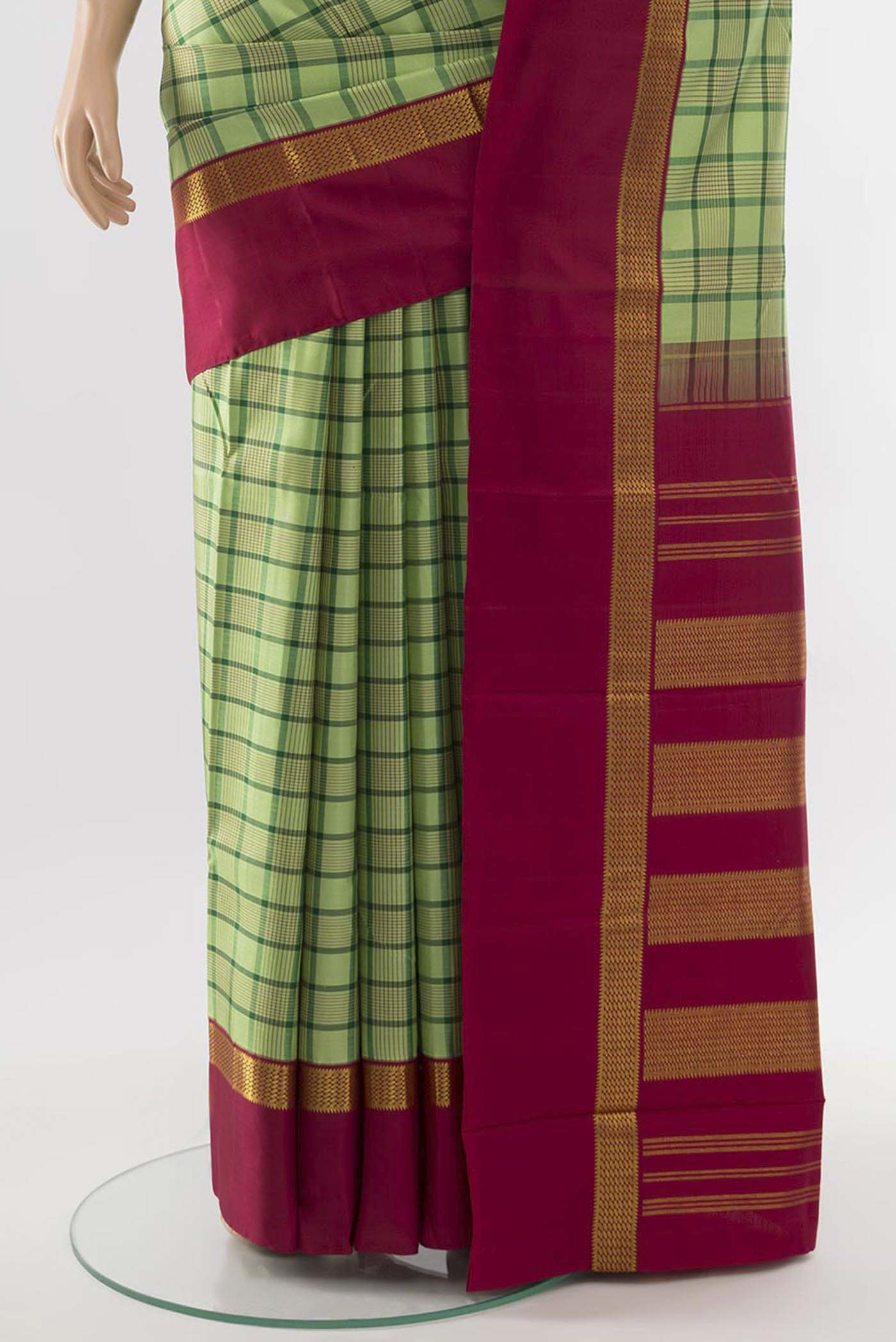 Pleats and pallu of Light Green Kanjivaram Silk Saree with Zari Butta on the body and Silk Border. 