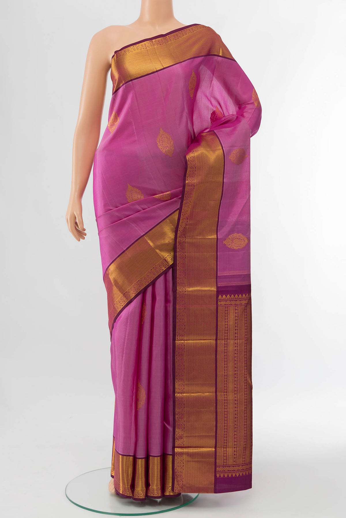 Pink Kanchipuram Silk Saree with Zari Butta on the body and Zari Border displayed on a mannequin