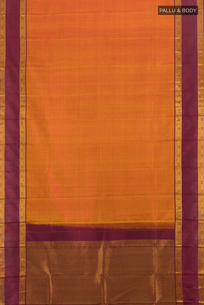Flat view of Mustard Kanjivaram Silk Saree with Zari Butta on the body and Silk Border. 