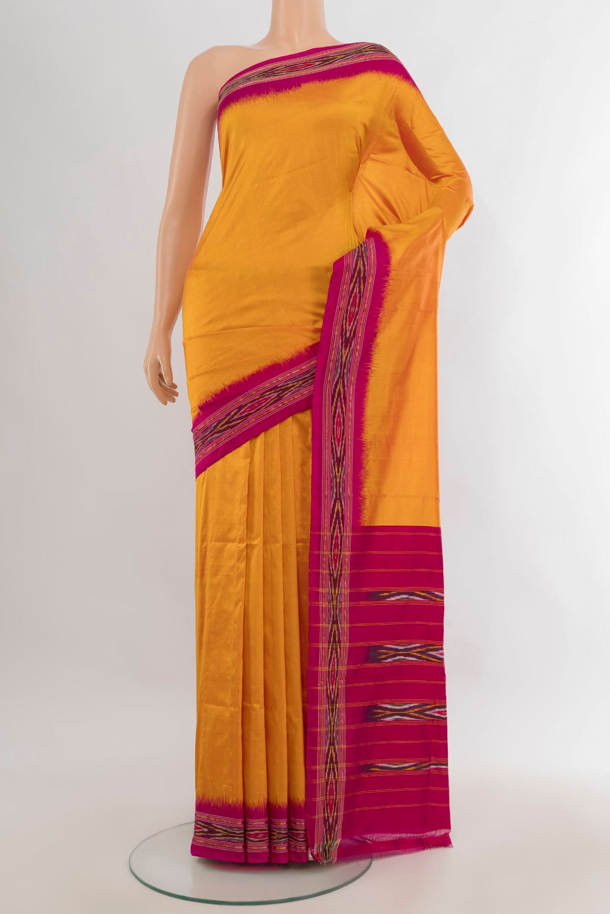 Pure Silk Yellow Pochampally Saree with Plain Body and Ikat Border.  displayed on a mannequin