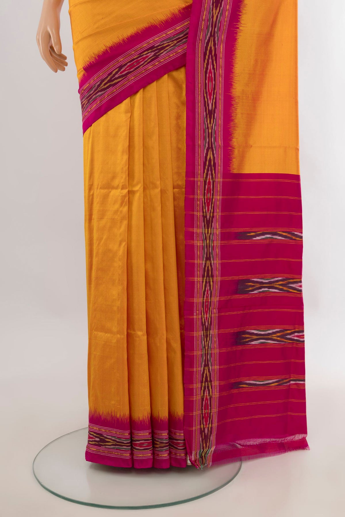 Pleats and pallu of Pure Silk Yellow Pochampally Saree with Plain Body and Ikat Border. 