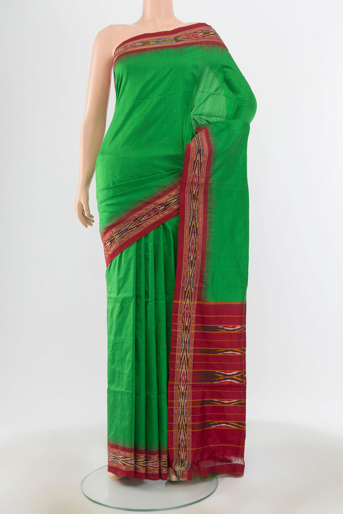 Mint Green Pochampally Saree with Ikat Print on the body and Silk Border.  displayed on a mannequin