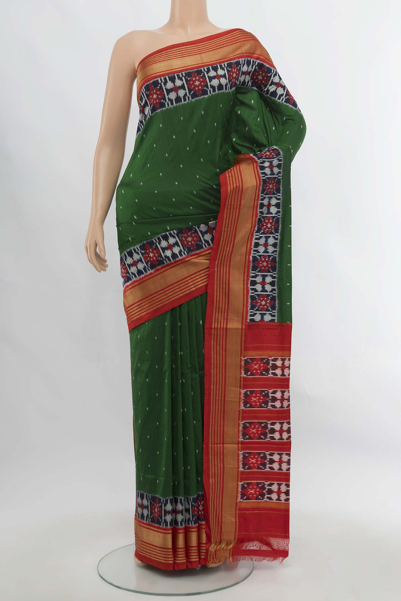 Bottle Green Pochampally Saree with Ikat Print on the body and Silk Border.  displayed on a mannequin