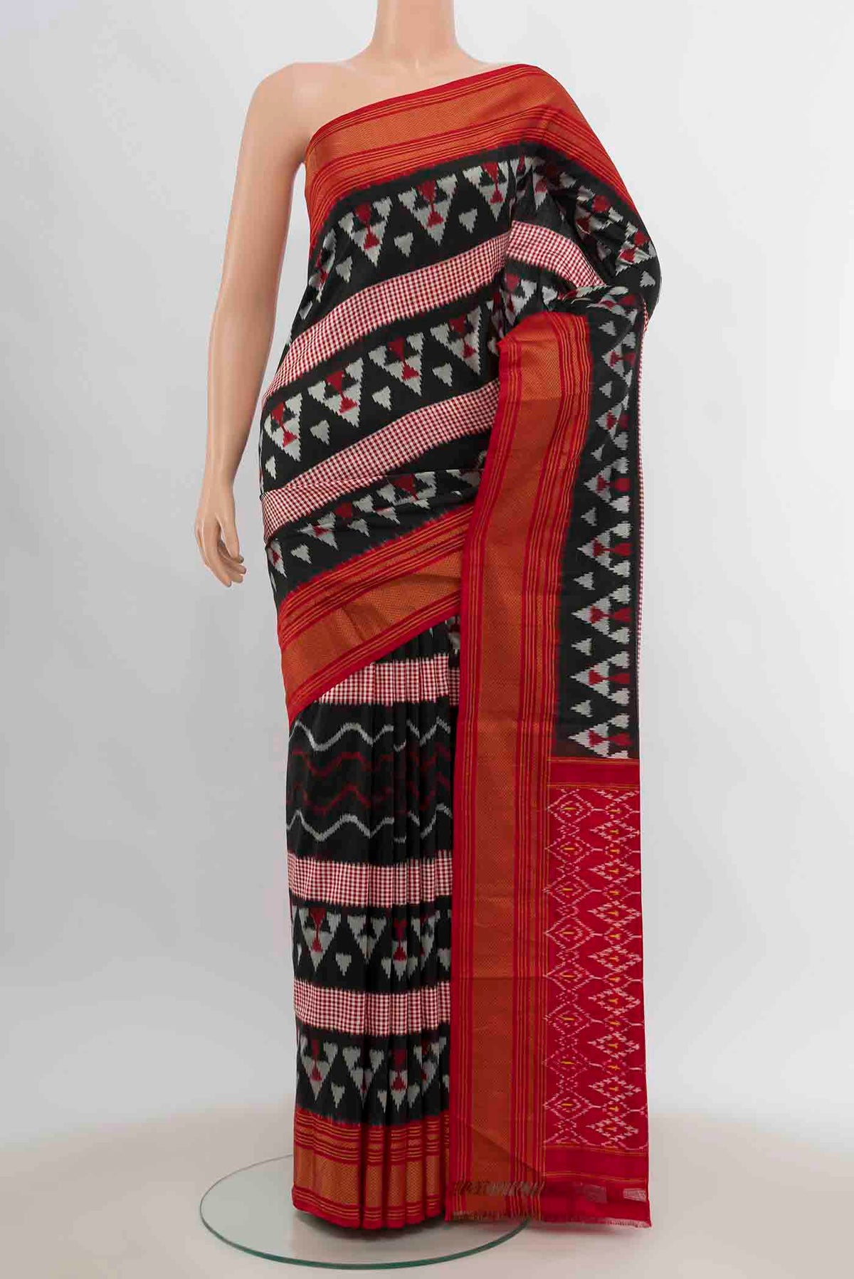 Black Pochampally Silk Saree with Pure Ikat on the body and Zari Border displayed on a mannequin