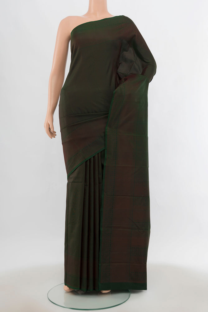 Mint Green Soft Silk Saree with Plain Body and Silk Border.  displayed on a mannequin