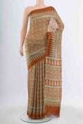 Brown Tussar Silk Saree with Floral Print on the body and Silk Border.  displayed on a mannequin