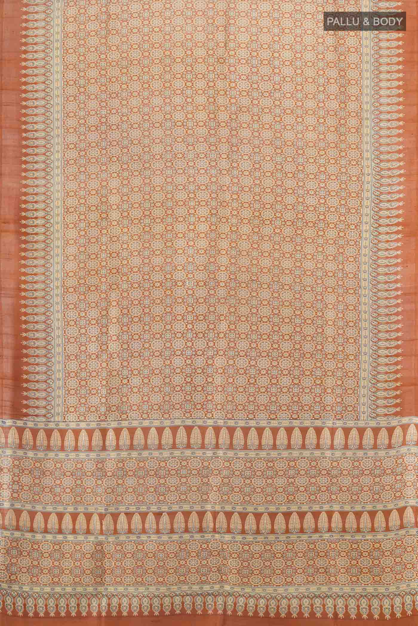 Flat view of Brown Tussar Silk Saree with Floral Print on the body and Silk Border. 