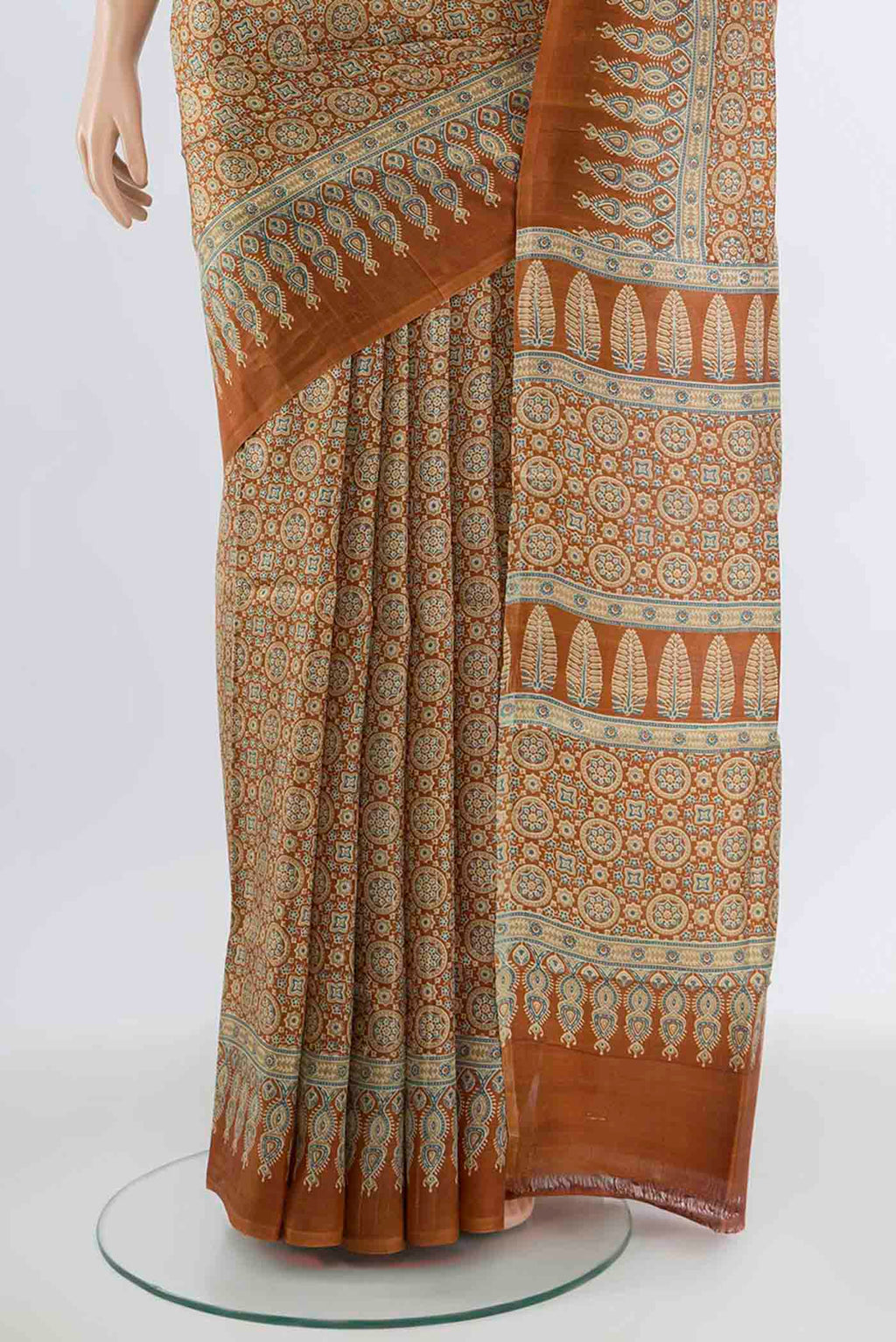 Pleats and pallu of Brown Tussar Silk Saree with Floral Print on the body and Silk Border. 
