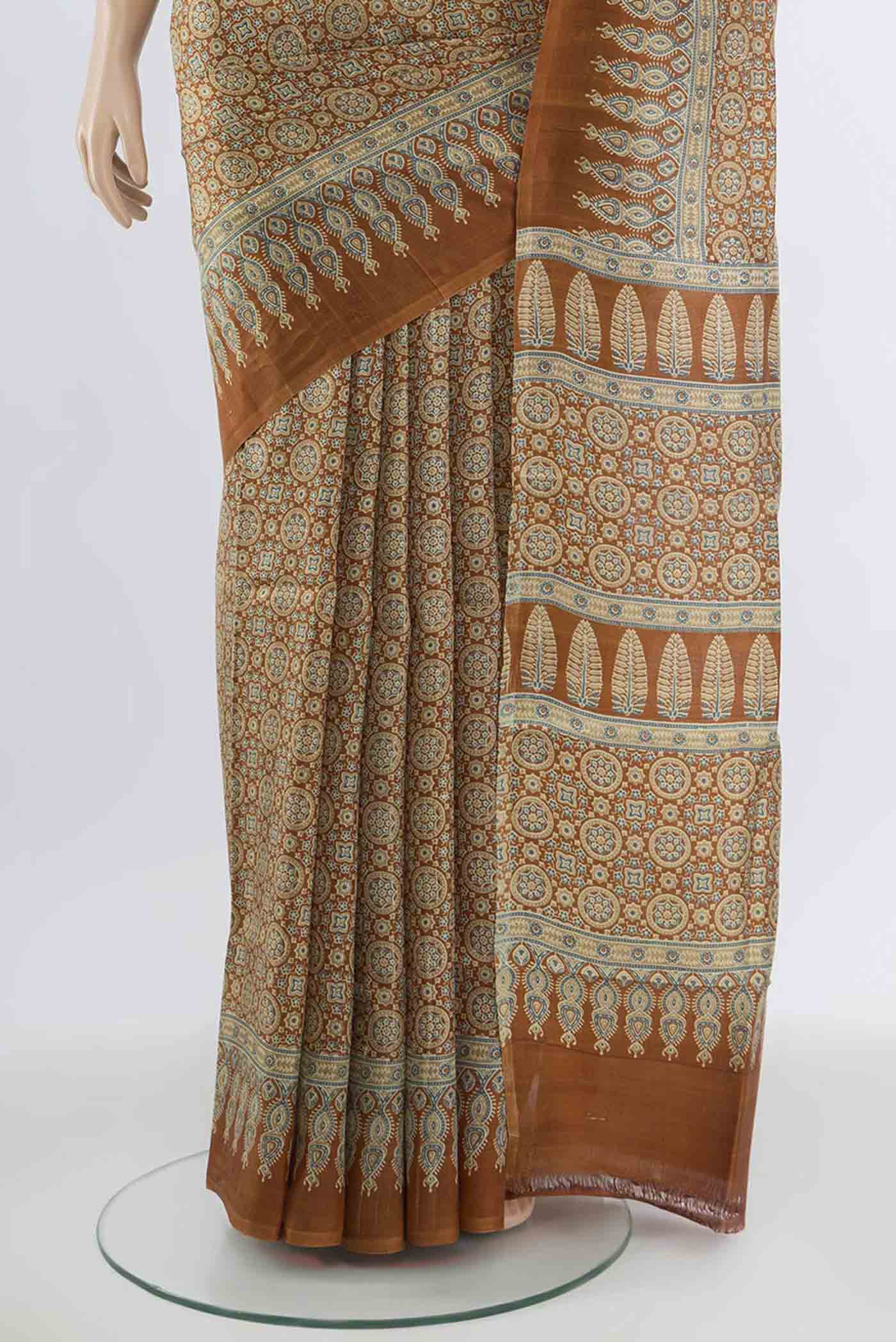 Pleats and pallu of Brown Tussar Silk Saree with Floral Print on the body and Silk Border. 