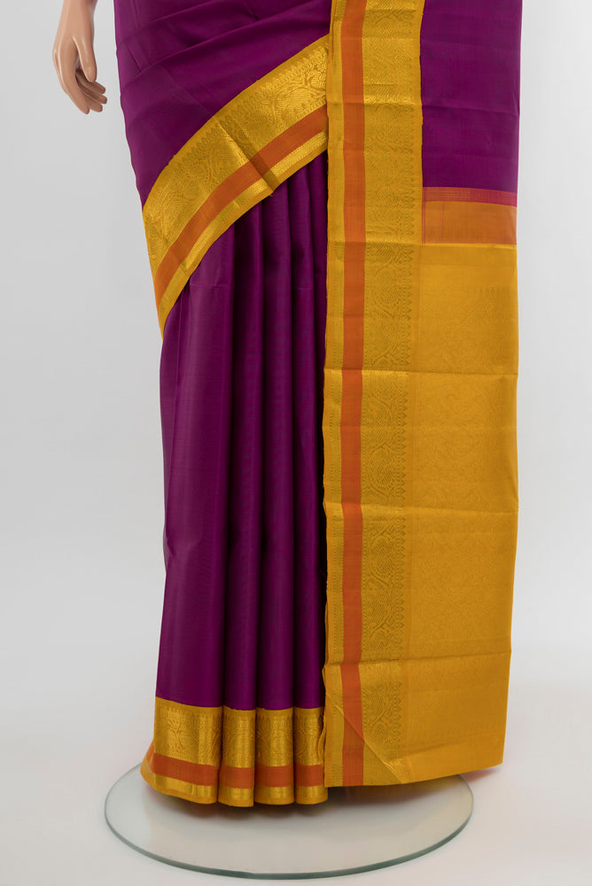 Pleats and pallu of Purple Kanjivaram Silk Saree with Plain Body and Silk Border. 
