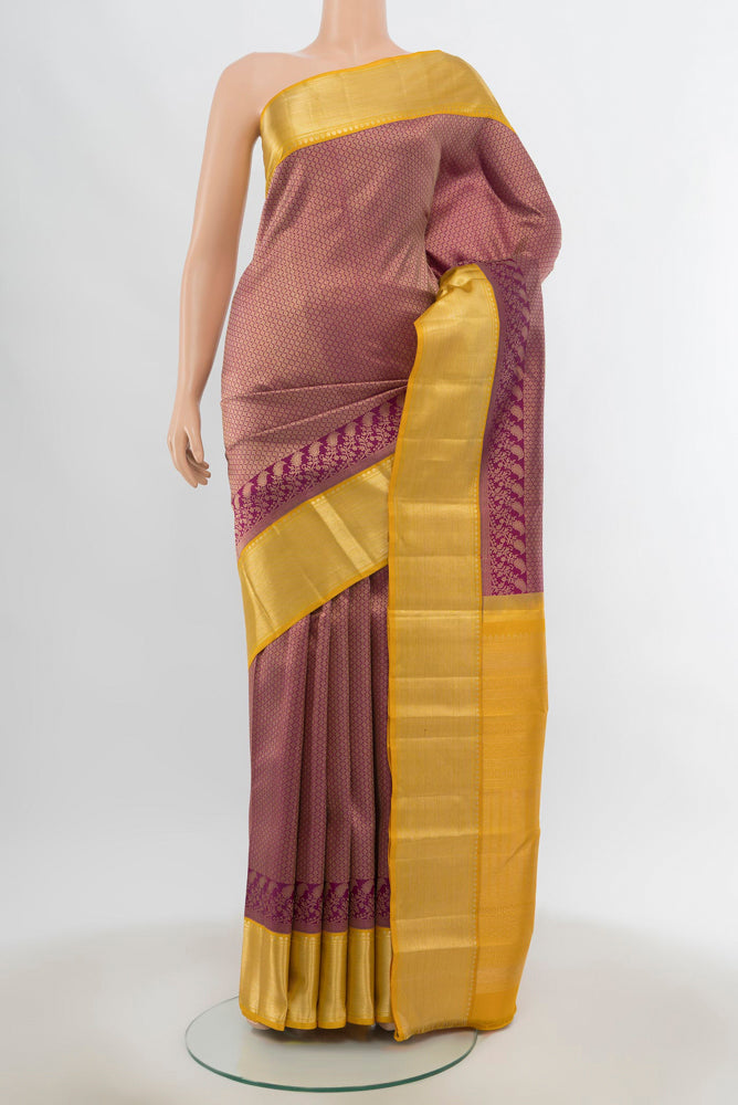 Pure Silk Pure Zari Purple Kanjivaram Saree with Zari Brocade on the body and Silk Border.  displayed on a mannequin
