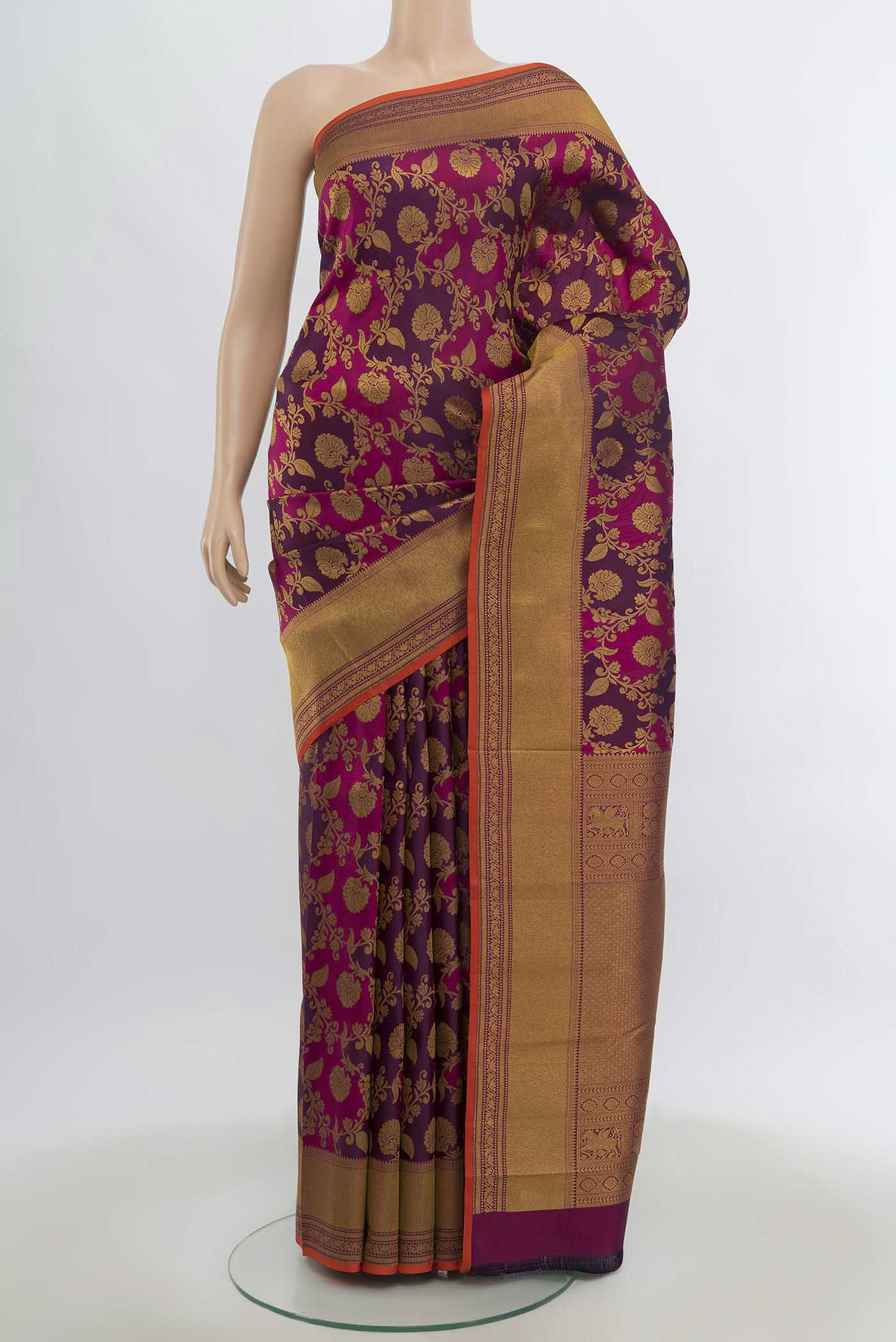 Multi Color Kanjivaram Silk Saree with Zari Butta on the body and Silk Border.  displayed on a mannequin